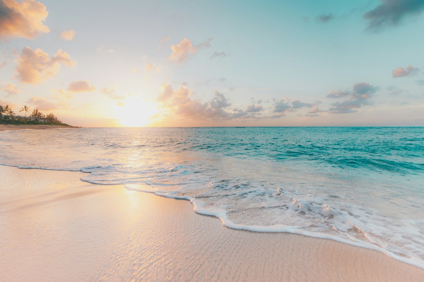 Turquoise water meeting a pale sand beach