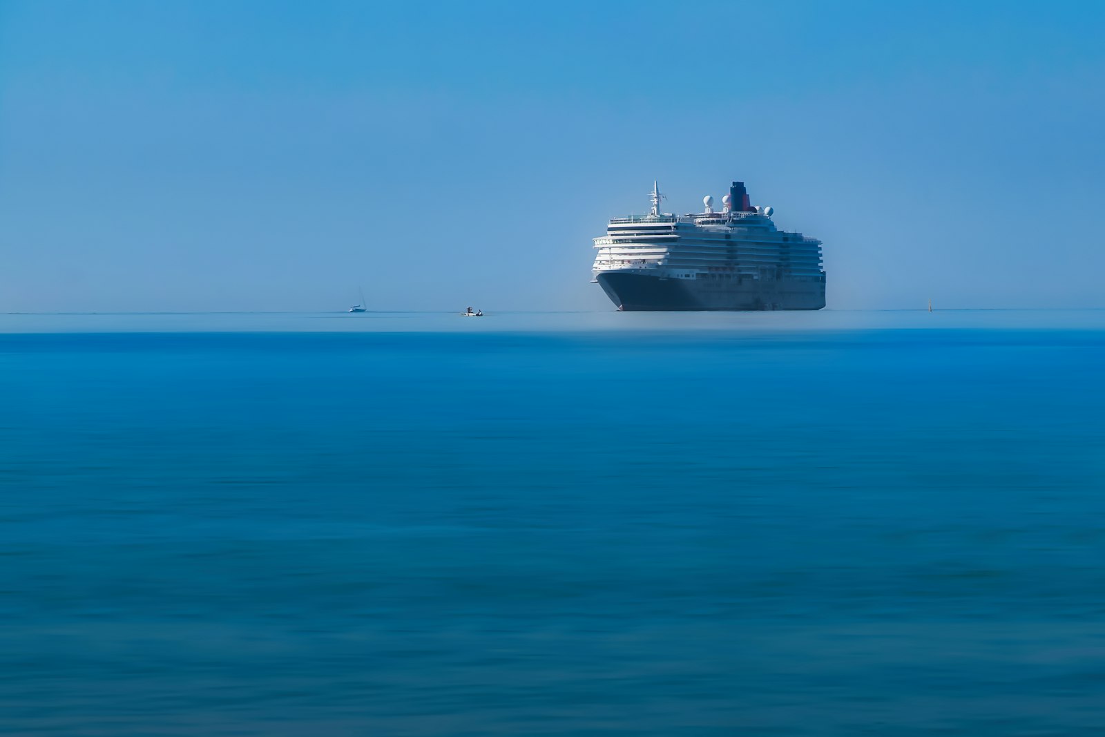 A cruise ship on calm open ocean