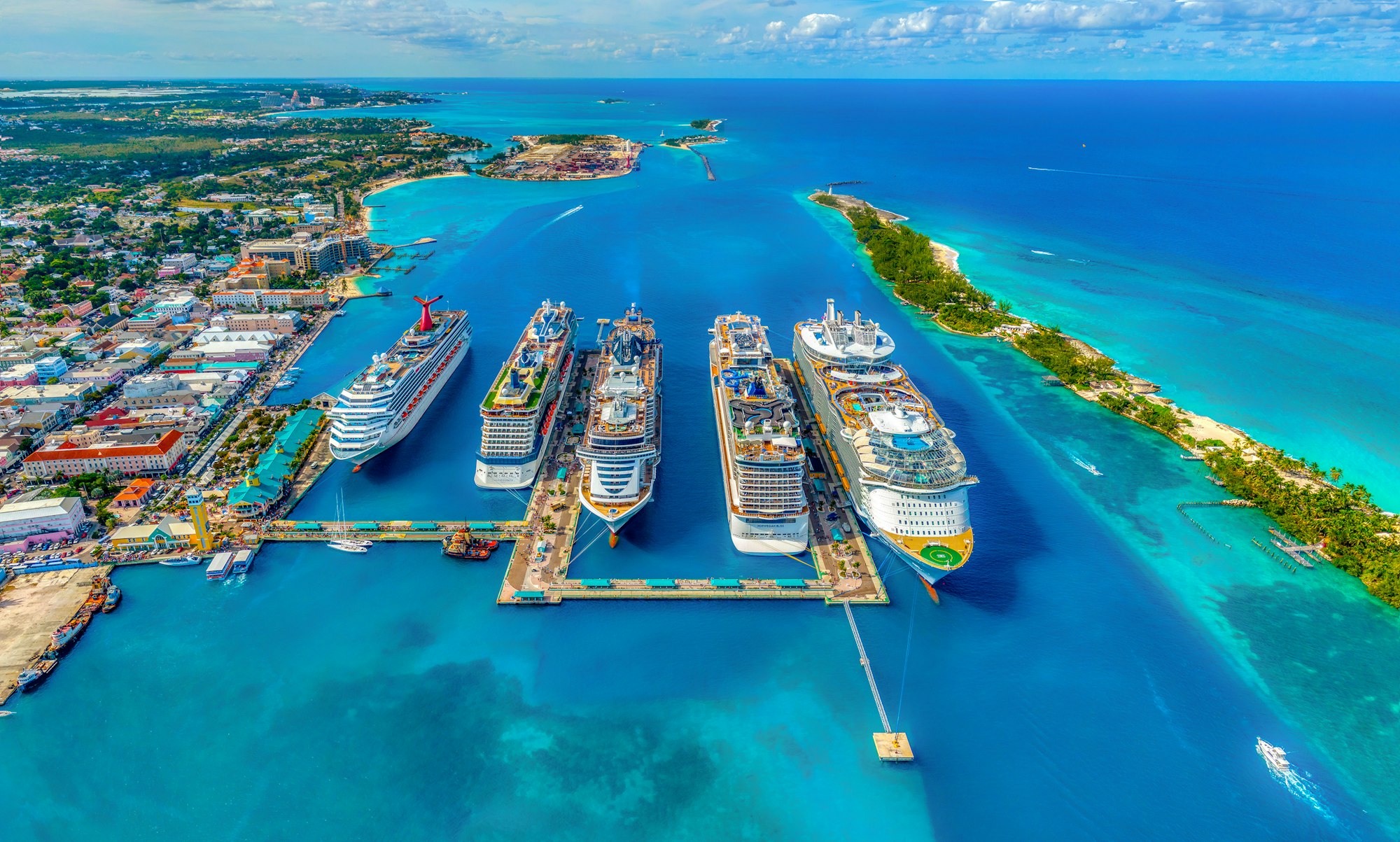 A white cruise ship on open blue water